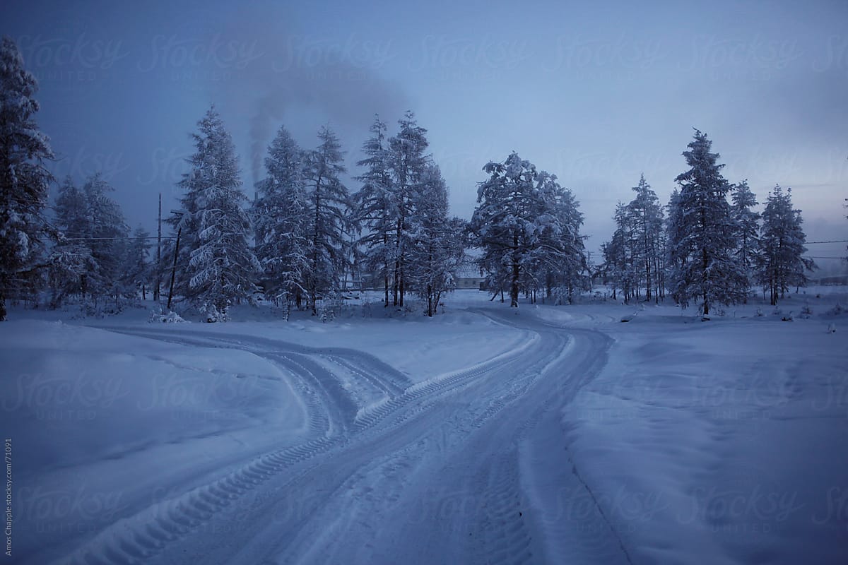 A road winding through deep snow in Siberia