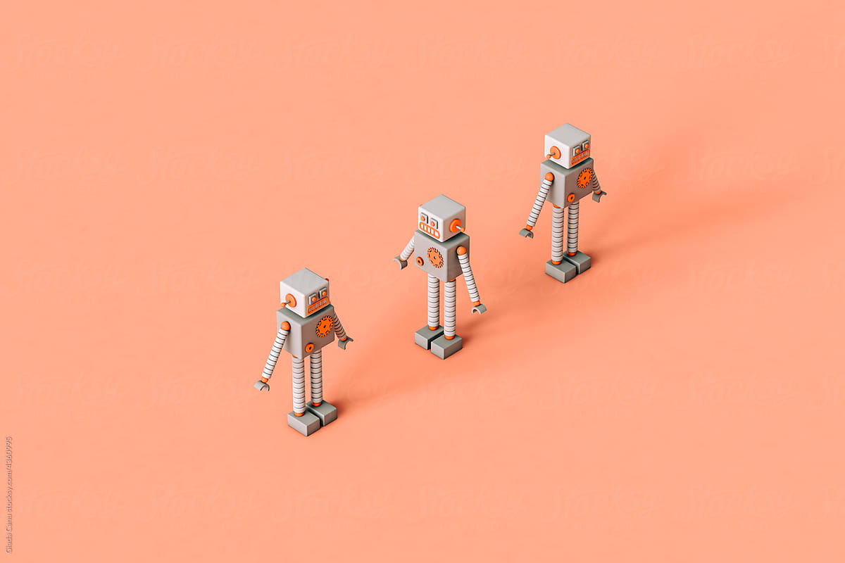 three tiny Toy robots on a pink background