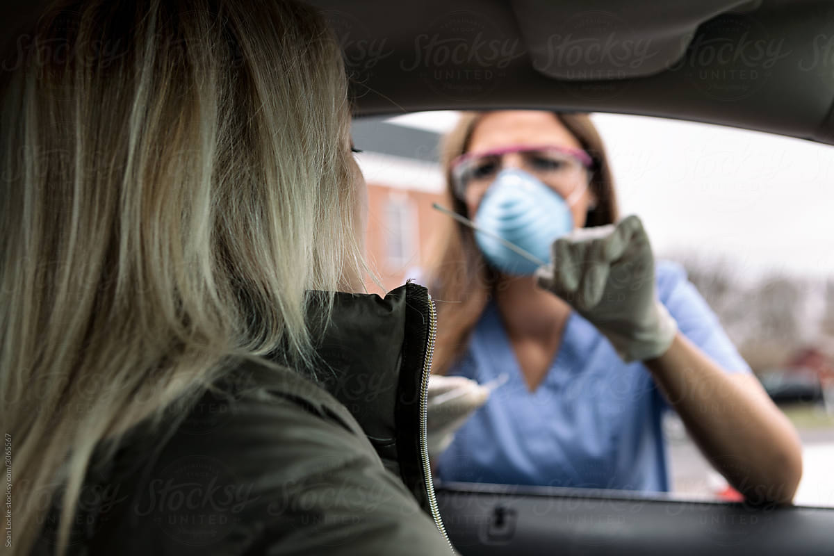 Exam: Health Professional Prepares To Do Nasal Culture At Drive Thru Clinic