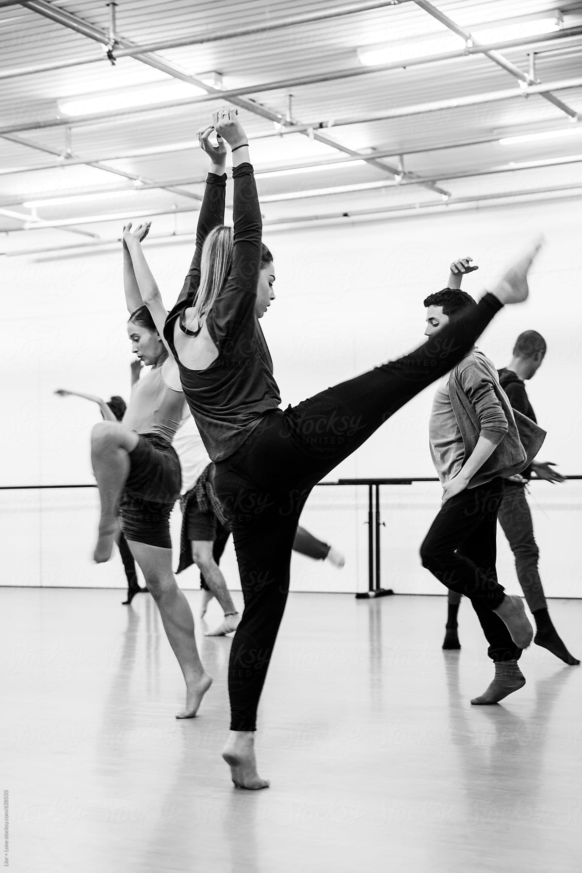 Dancers practicing routine in studio