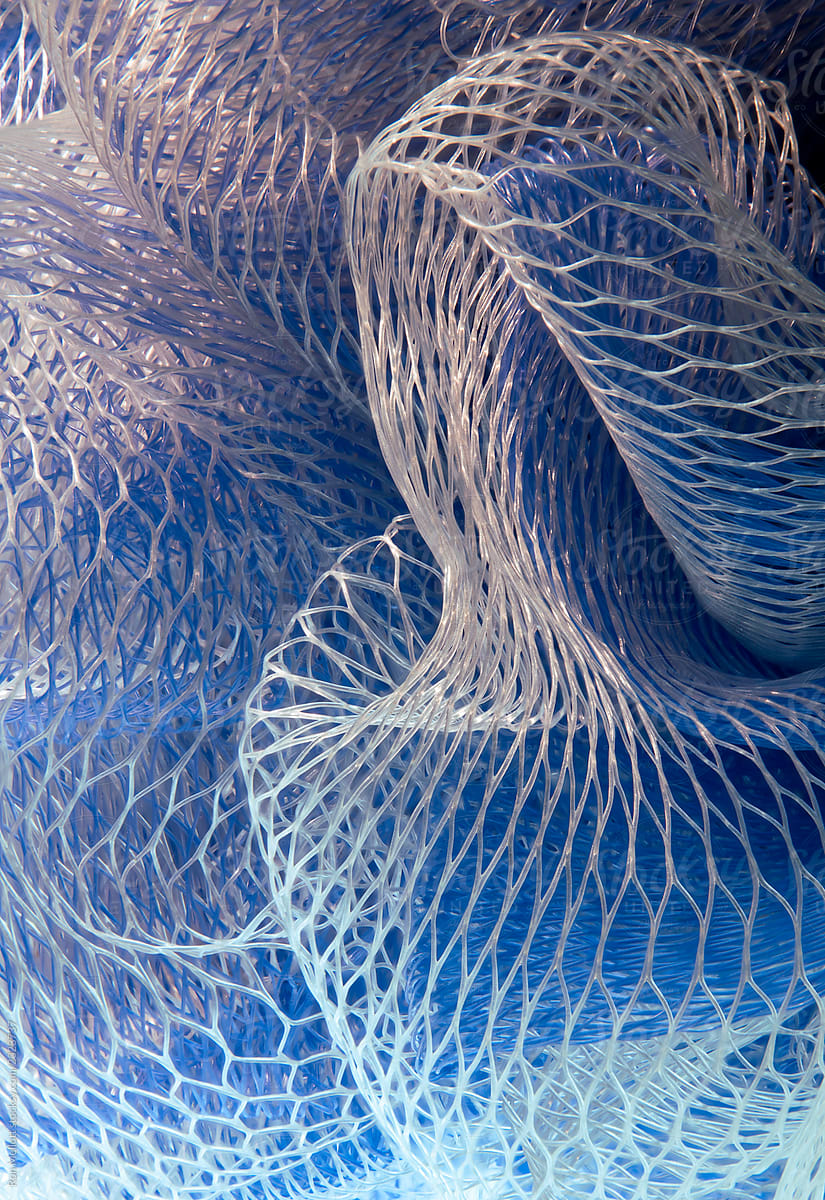 macro of blue and white mesh fabric
