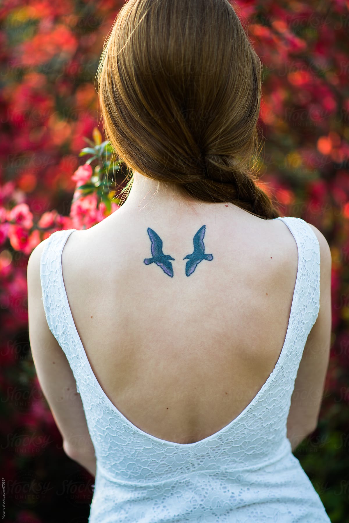 Bird back tattoo female
