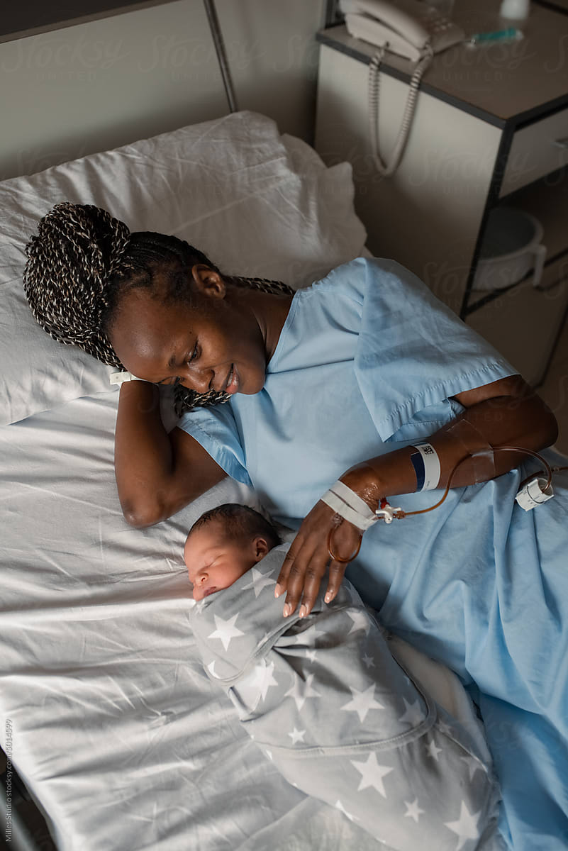 Black mother with baby resting after childbirth