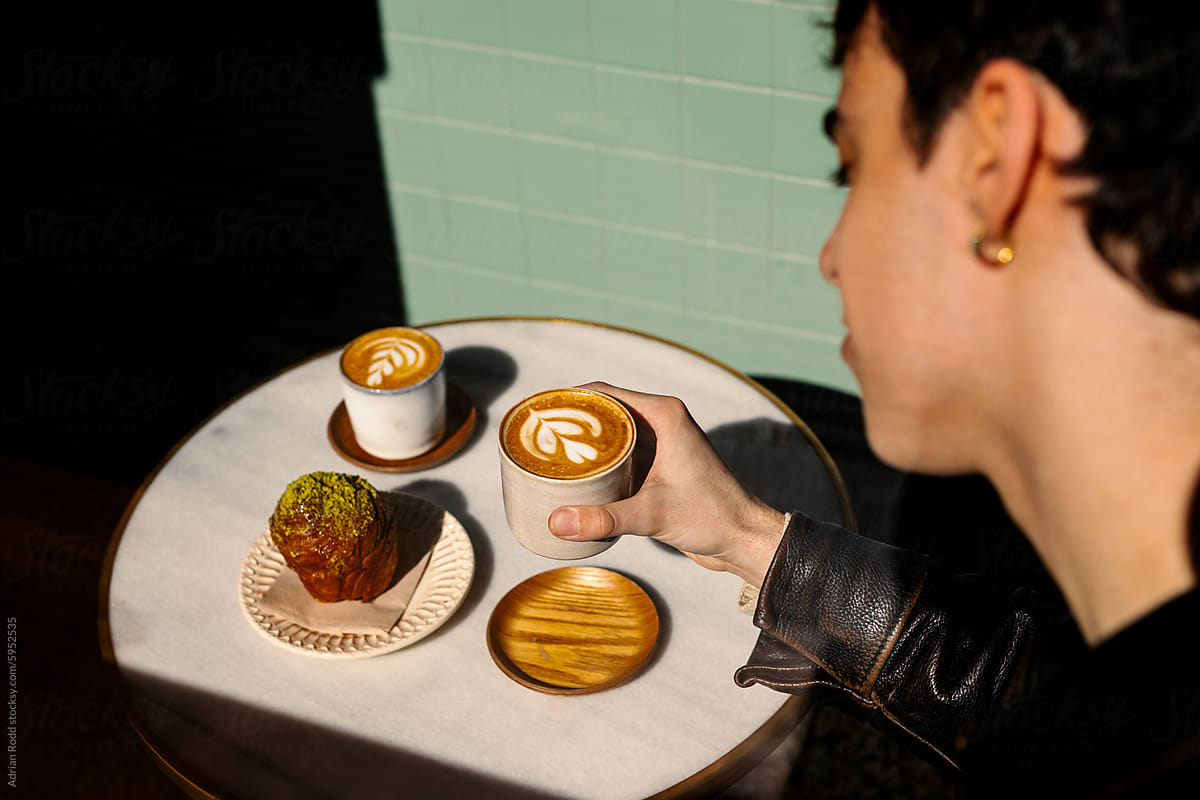 A young man having breakfast in a specialty coffee