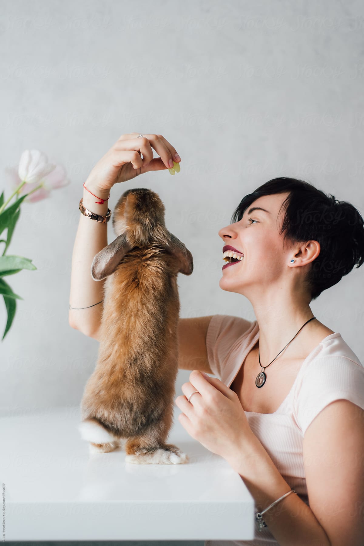 Smiling woman with cute hare