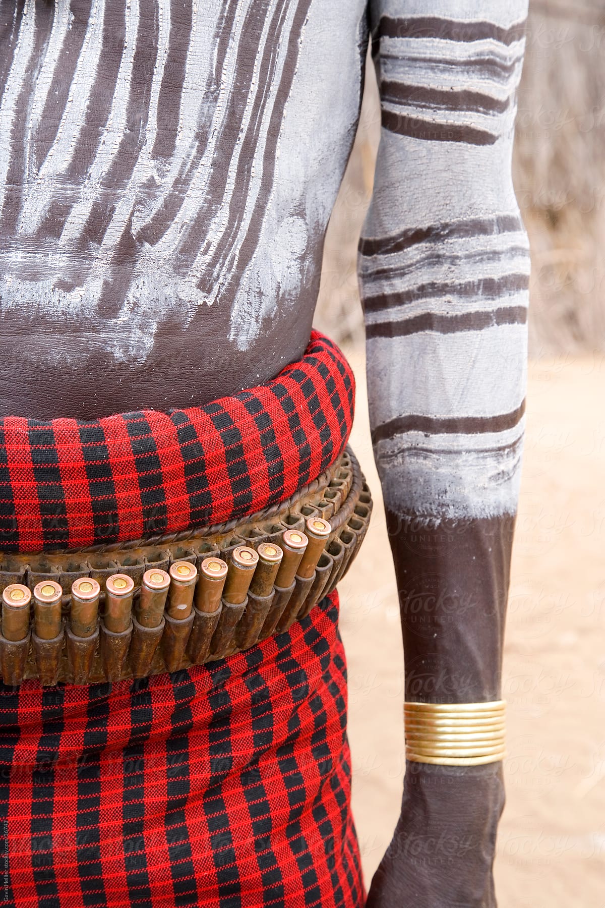 Karo Tribesman wearing a belt of bullets,  Lower Omo Valley, Ethiopia, Africa