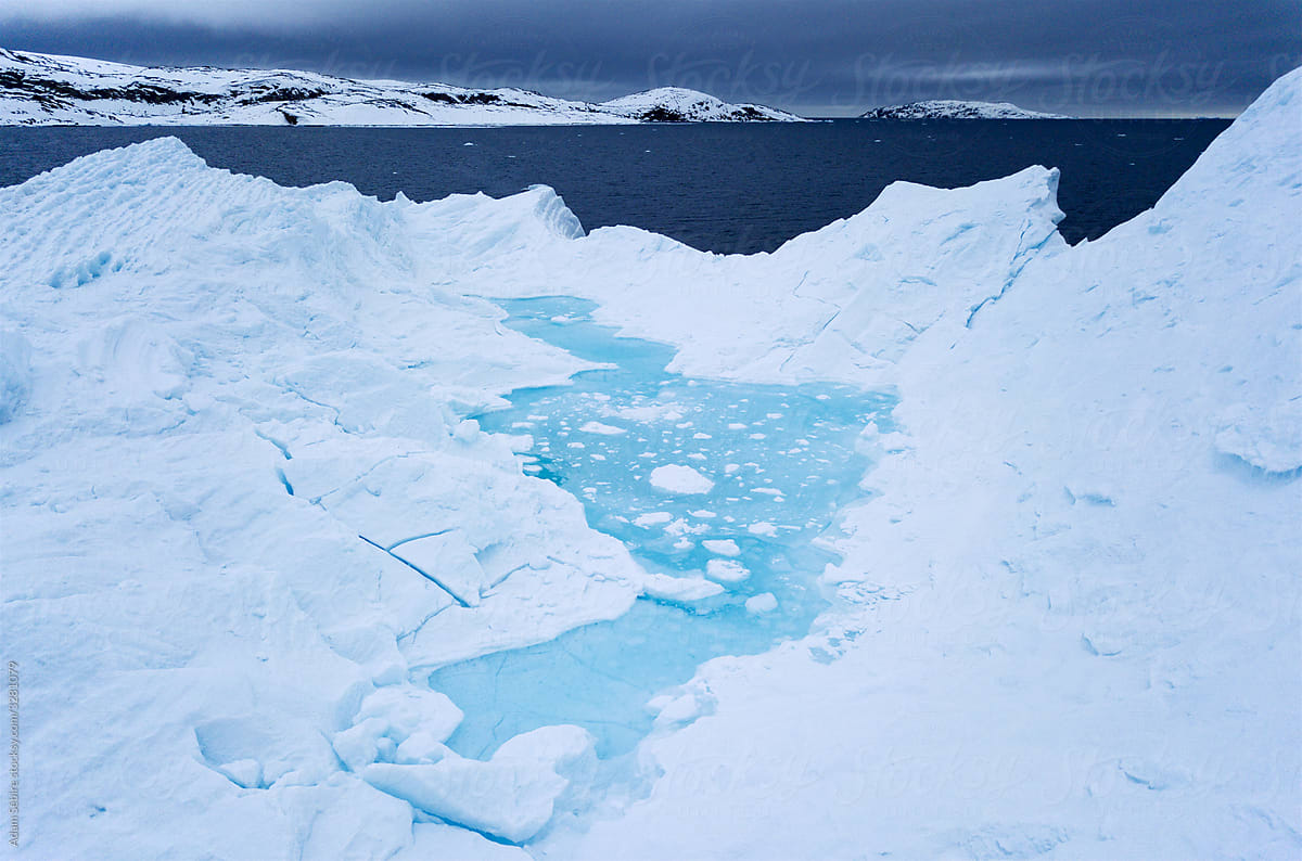 Greenland thaws due to rising temperatures of climate change, beautiful melted water pool