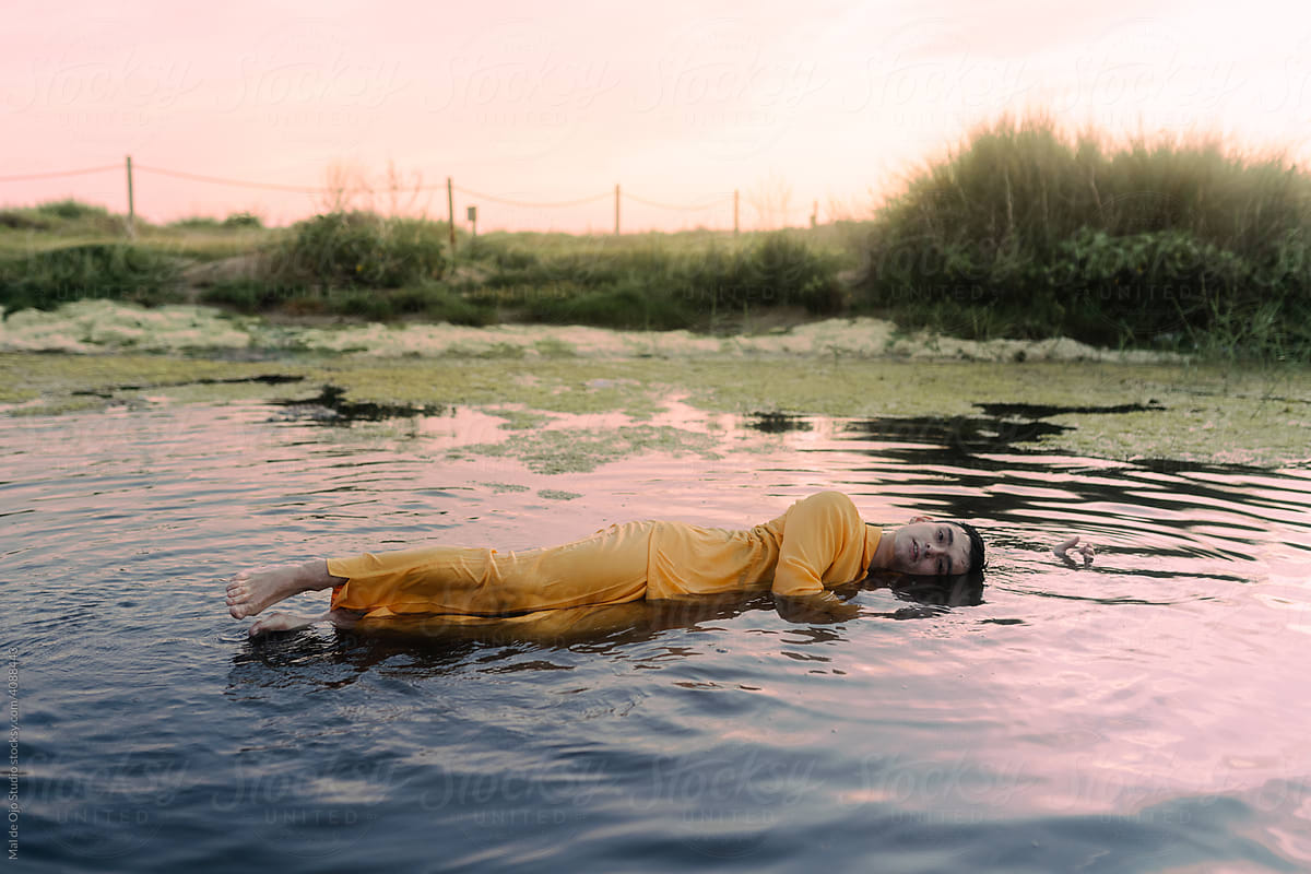 Contemporary dancer floating in water