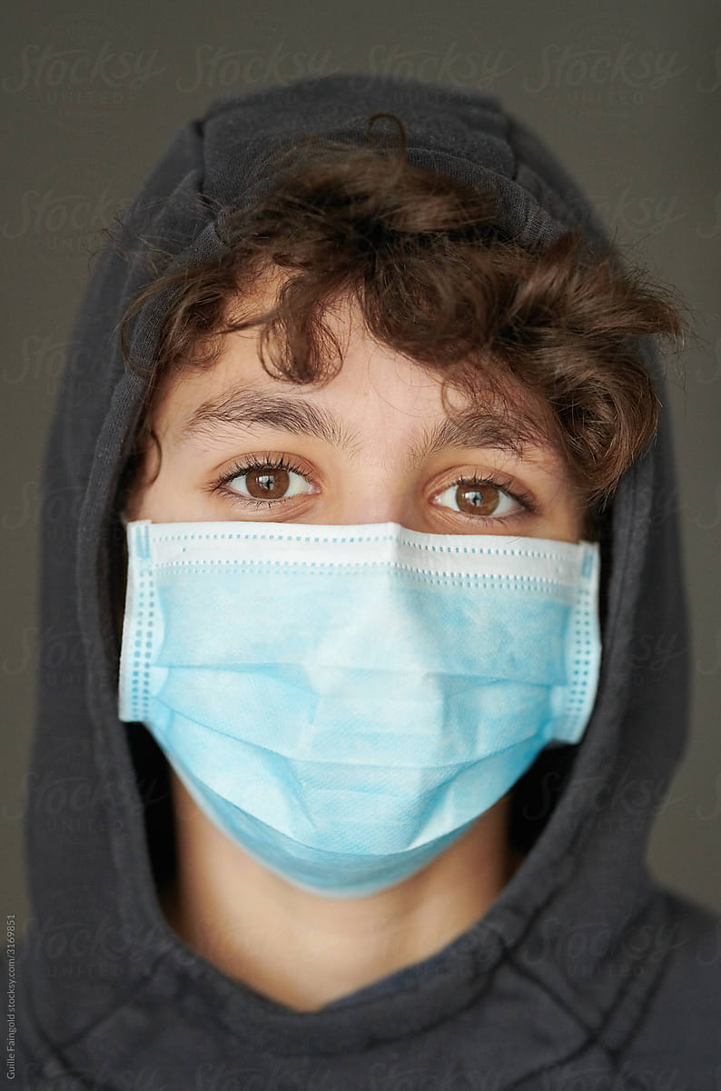 Teenager in medical mask