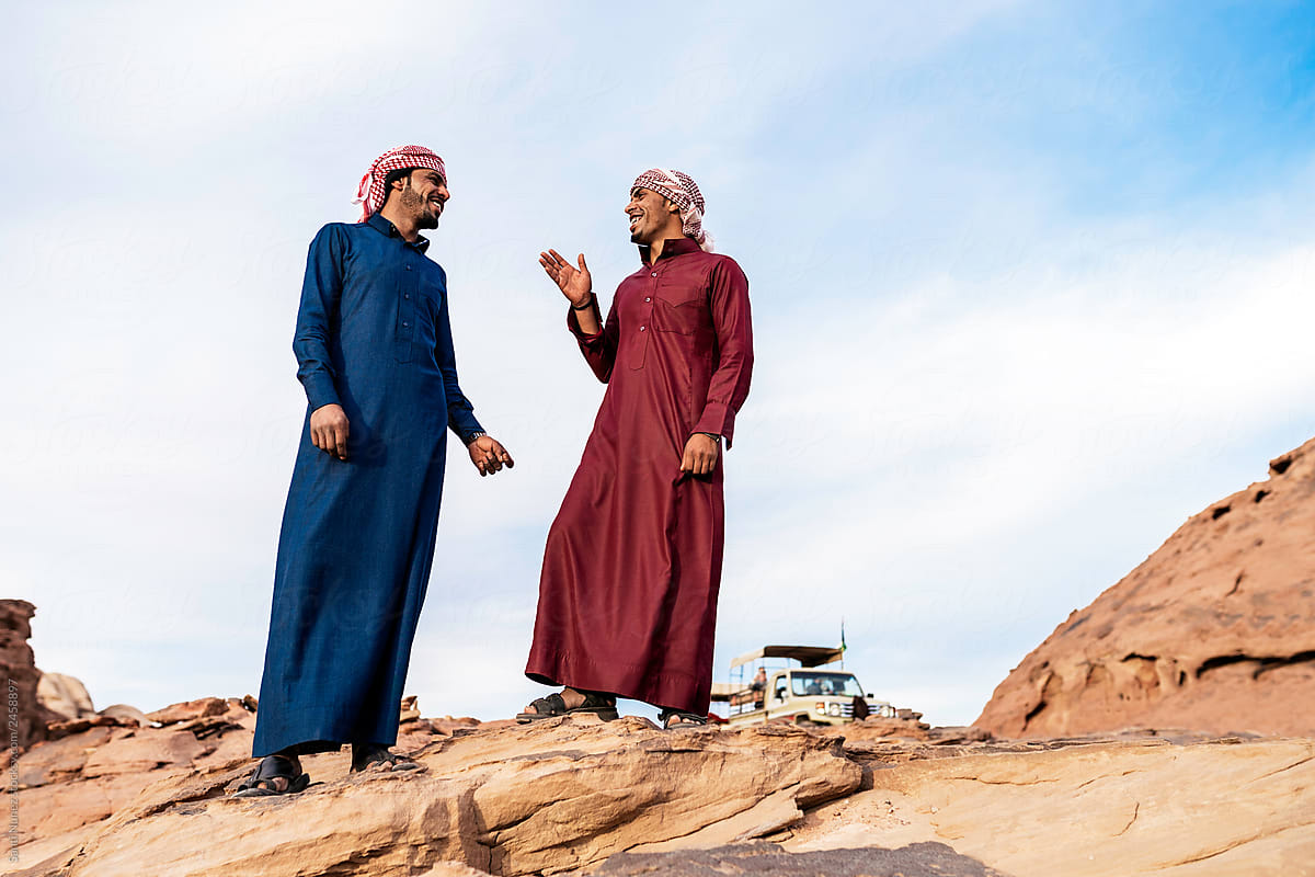 Arabic Men Talking Near Mountains
