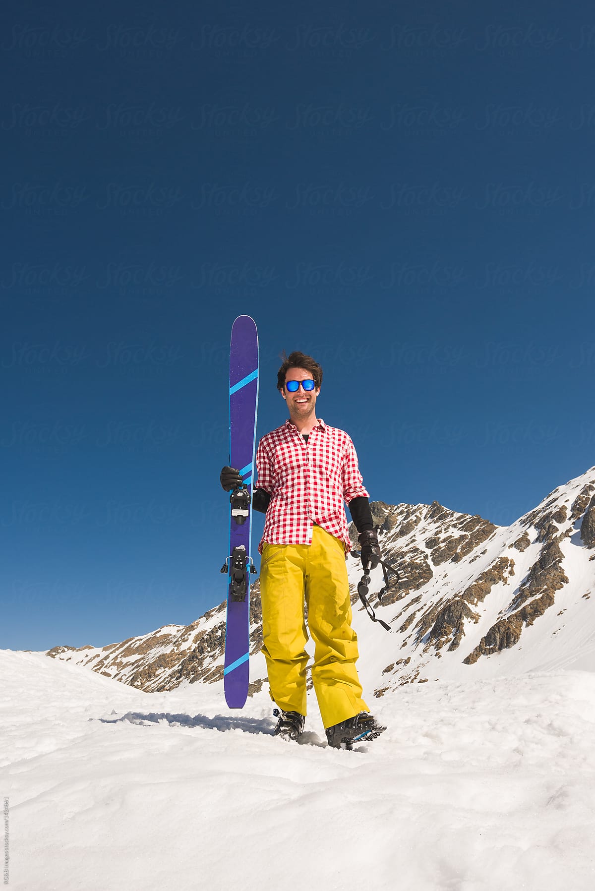 Portrait of happy male skier wearing vintage checked shirt