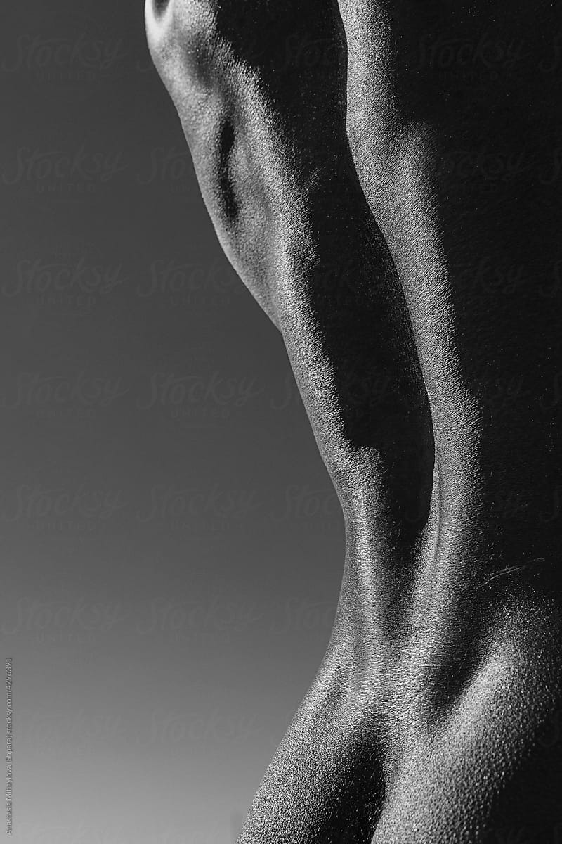 Back muscles of black man close up black and white