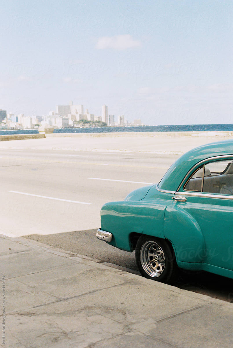 Classic American car with a city view in   Havana Cuba
