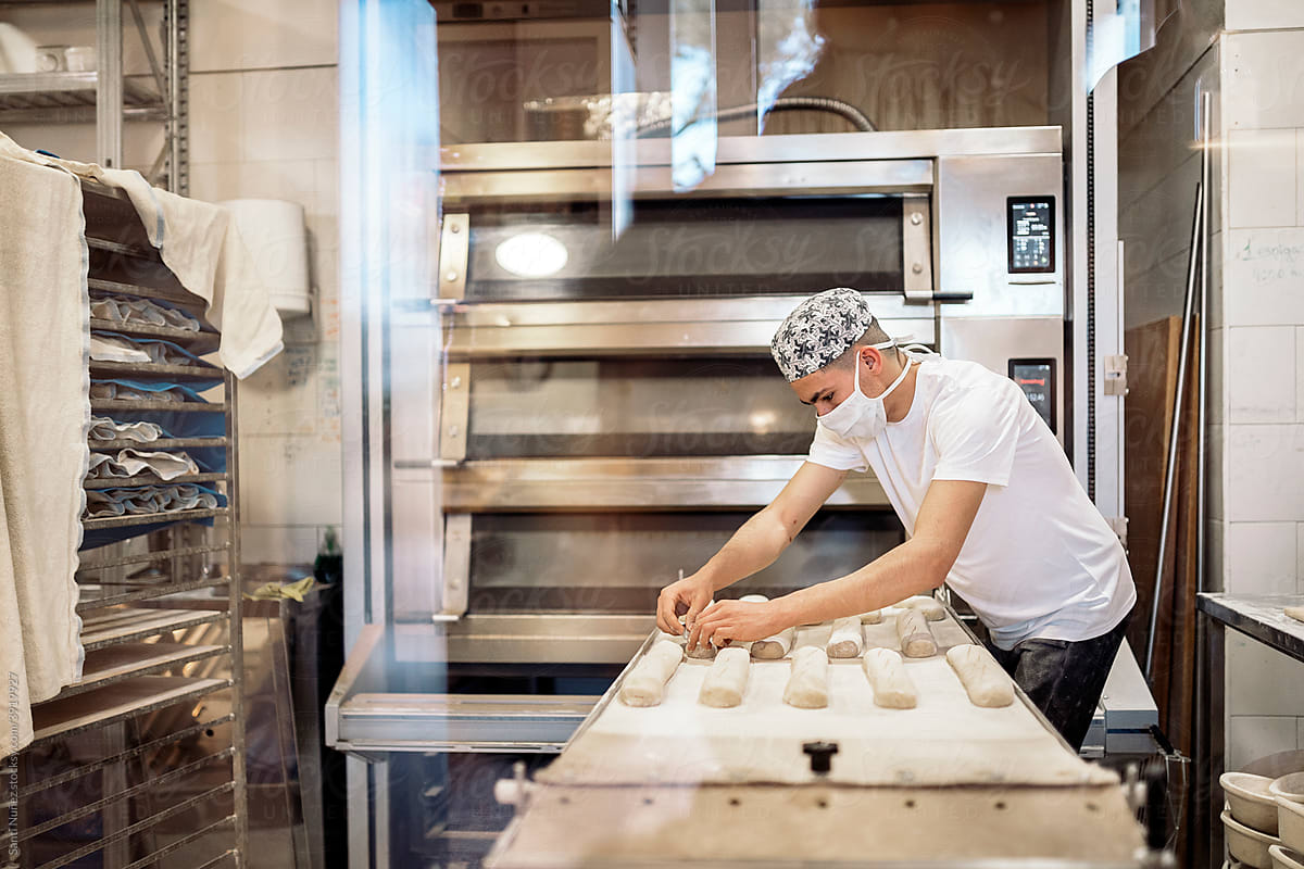 Young Man Working in Bakery Shop