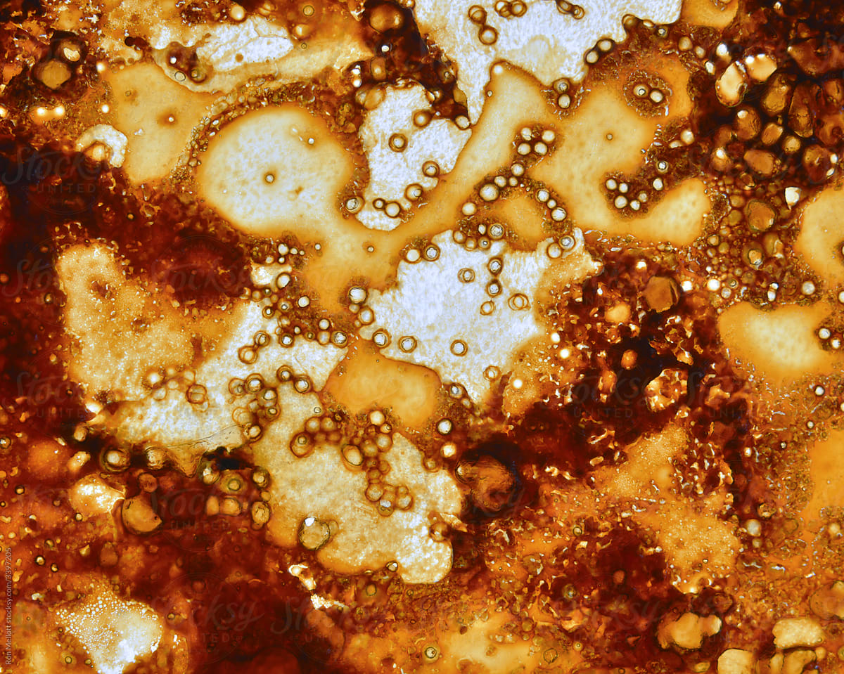 macro of grease residue patterns in a glass broiling pan