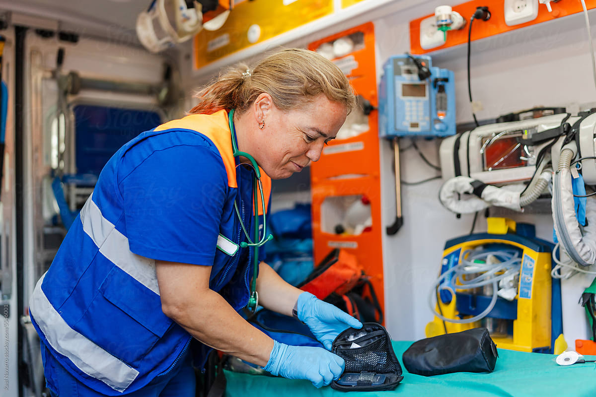 smiling female paramedic at work in an ambulance