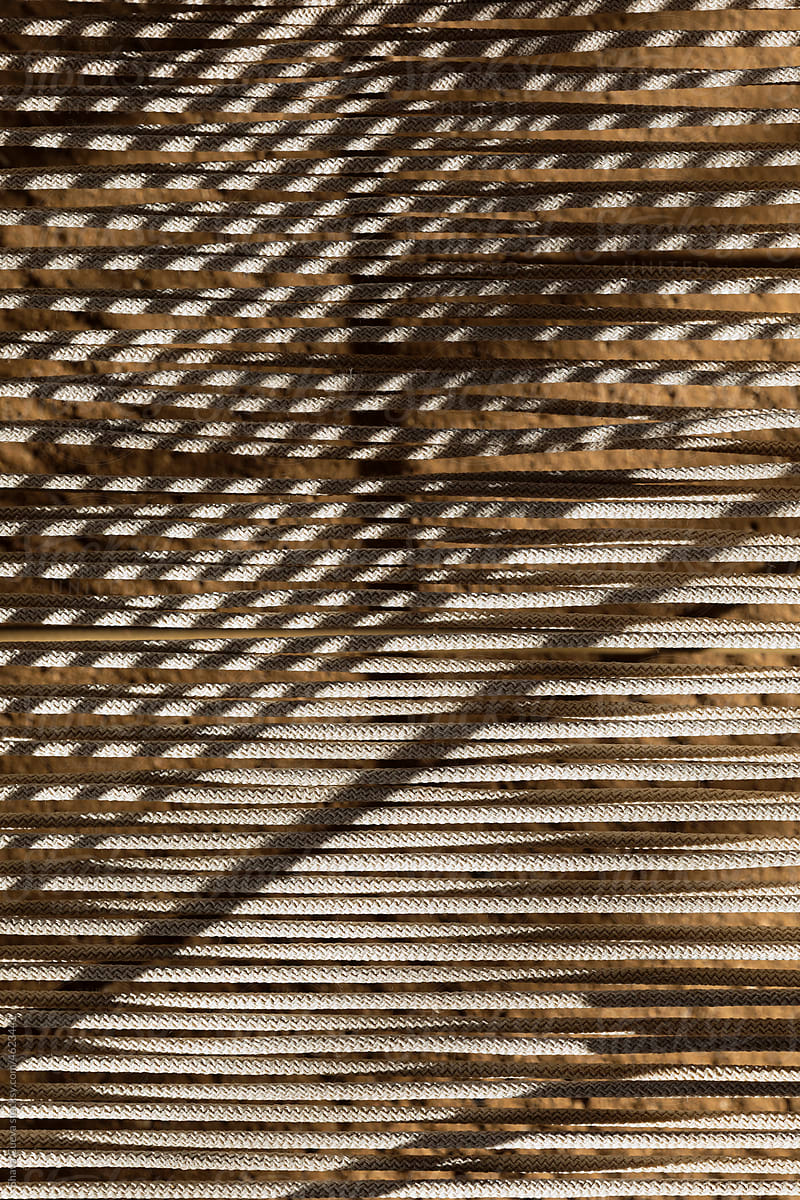 Closeup of the textures of a fabric made with beige macrame