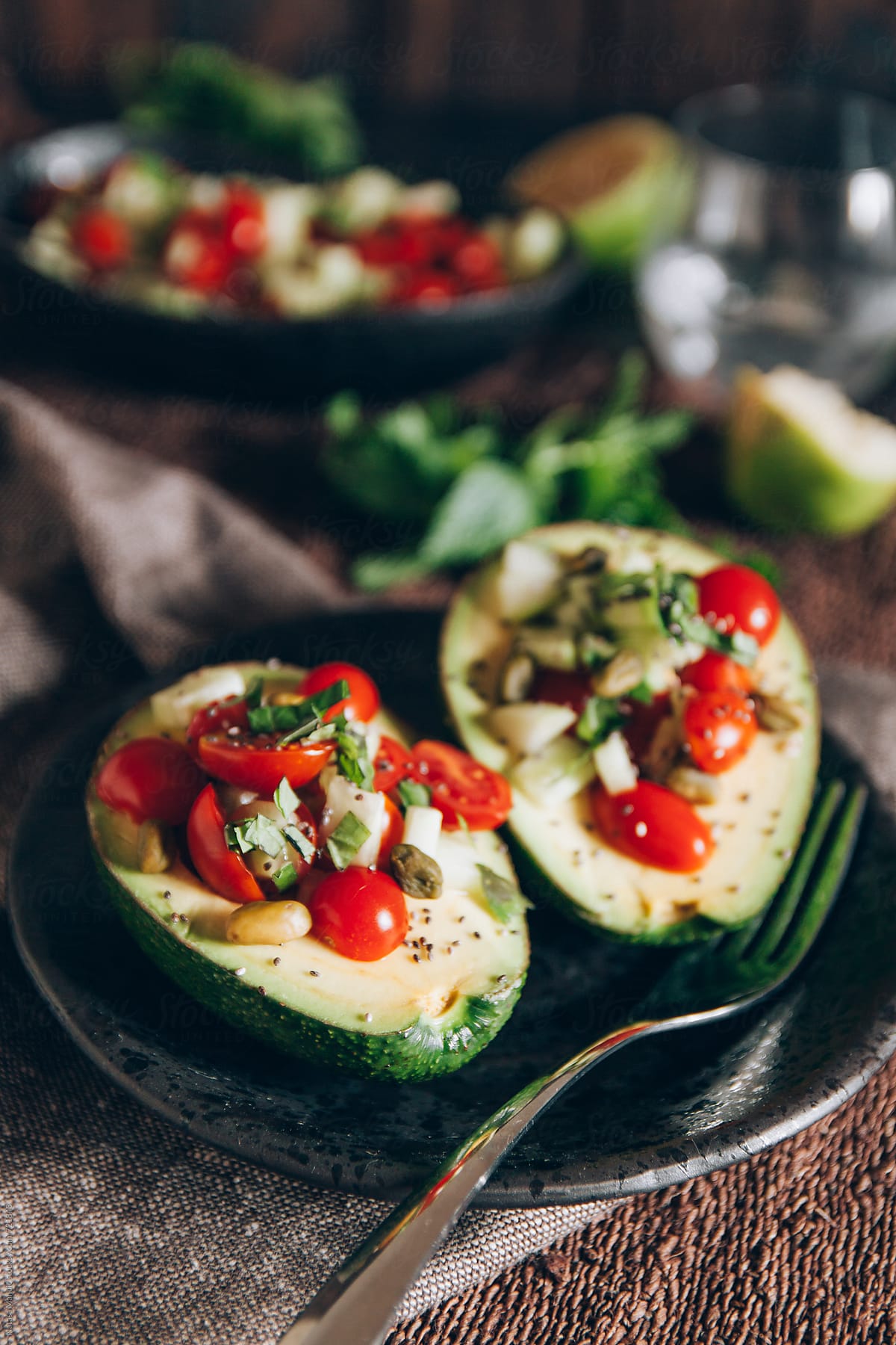 Avocado salad with cherry tomatoes, cucumbers and mint