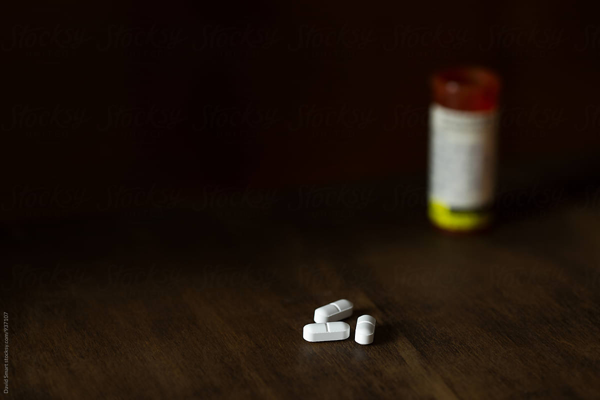 Opiates lying on a dark table