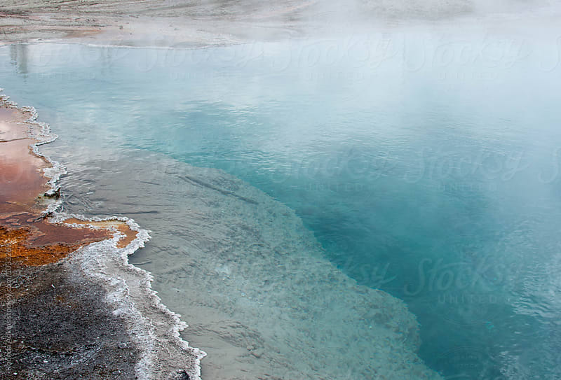 Steaming aqua hot spring and rust bacteria