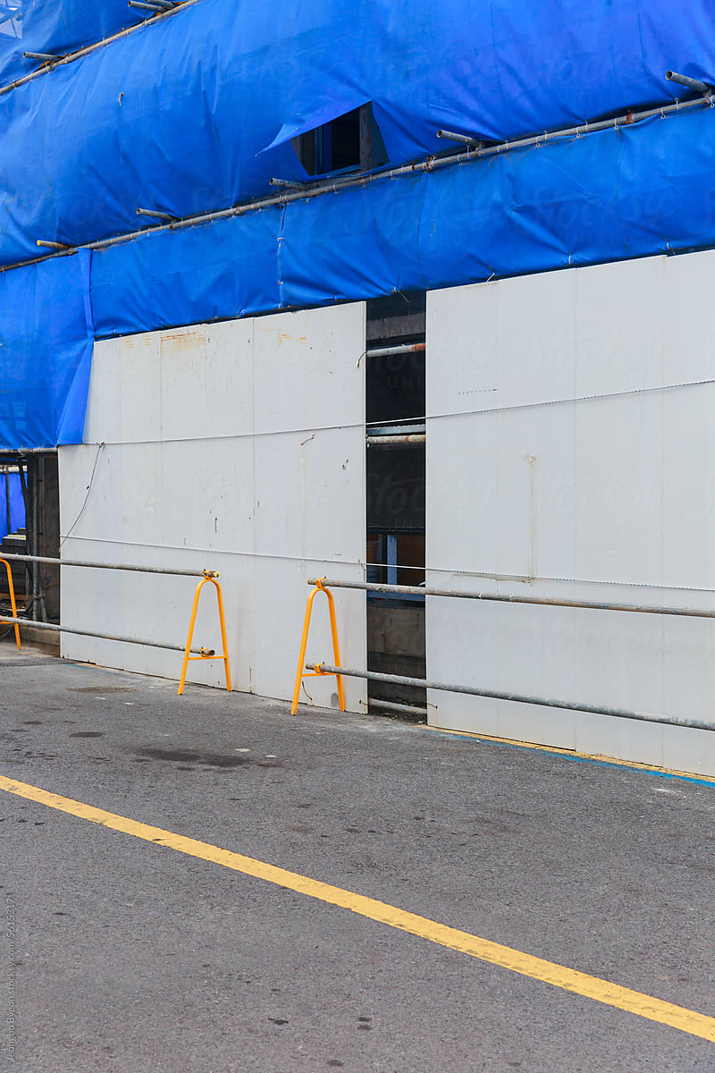 Construction site covered with a blue screen.