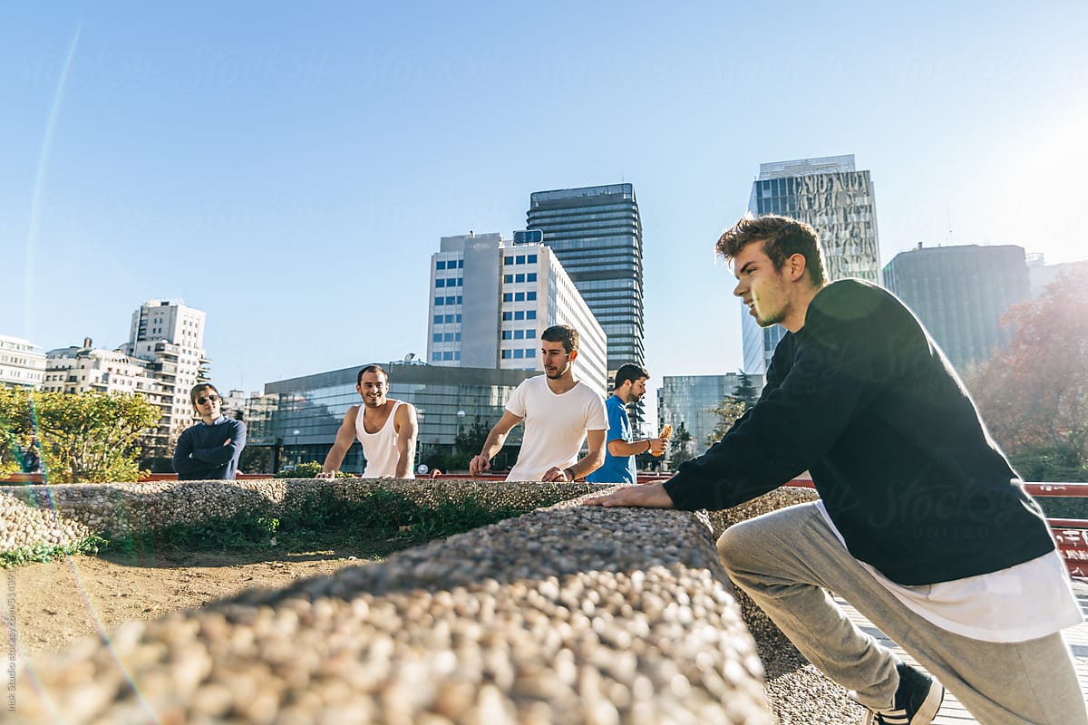 Group of men resting during a parkour training
