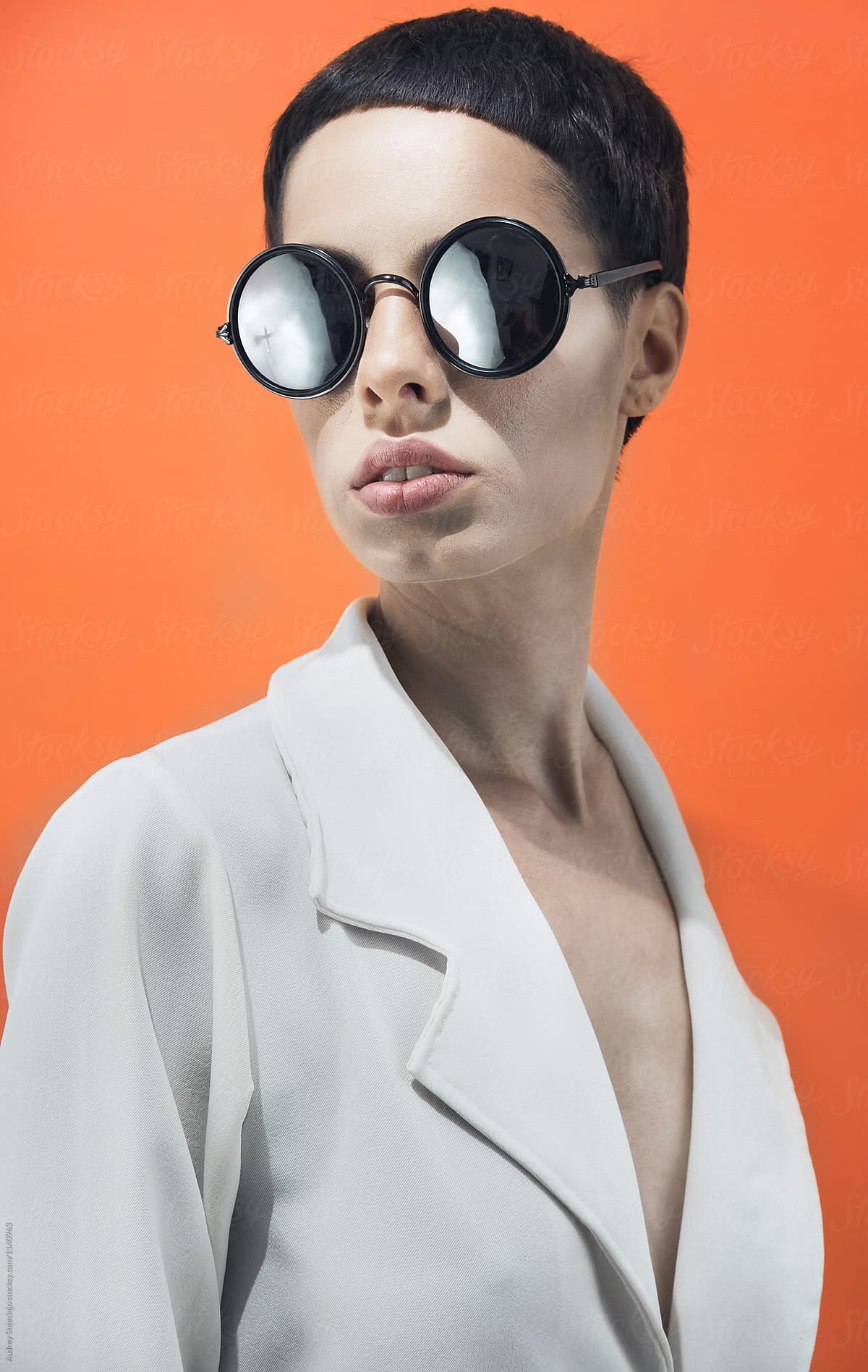 Fashion/conceptual portrait of female with sunglasses.