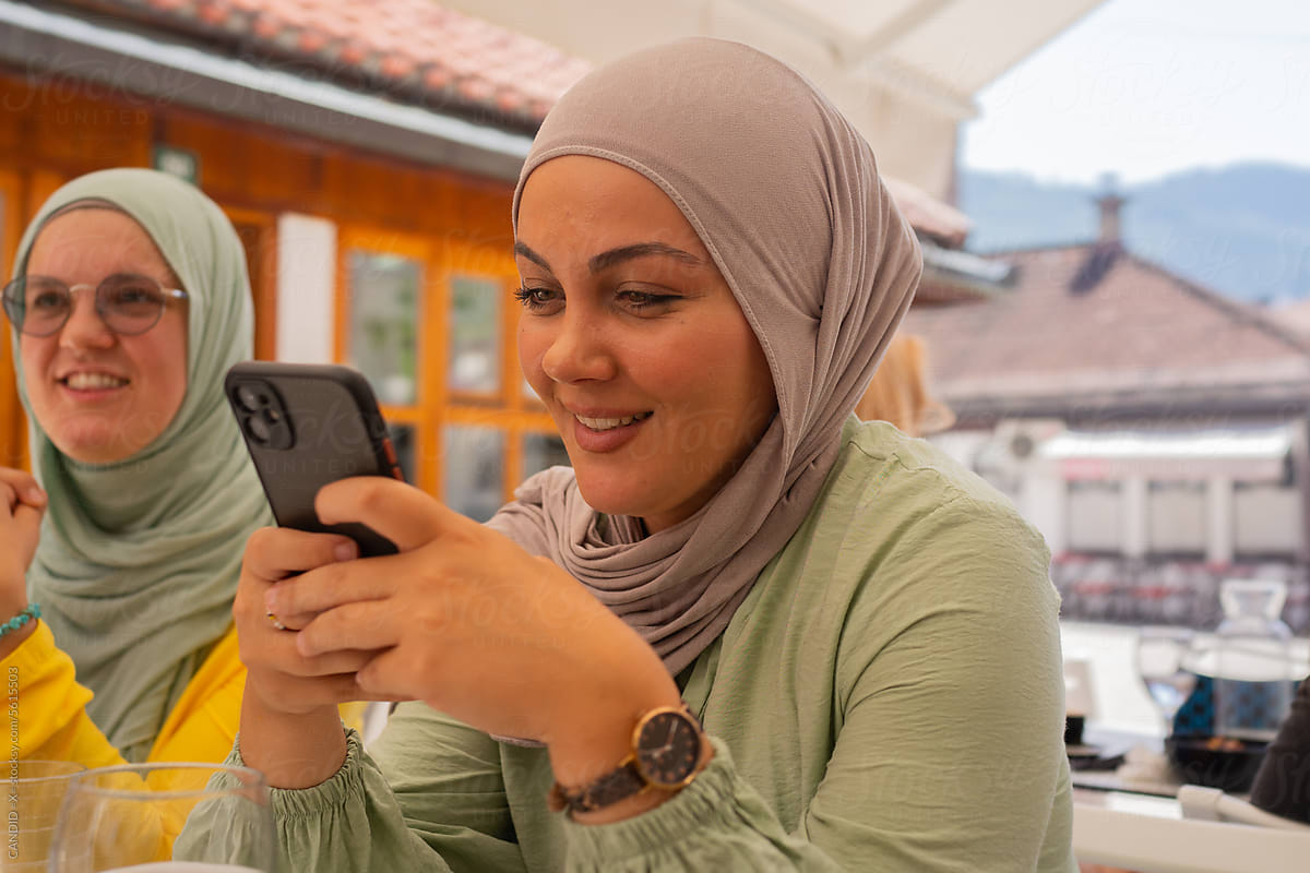 Muslim Woman Texting on her Phone