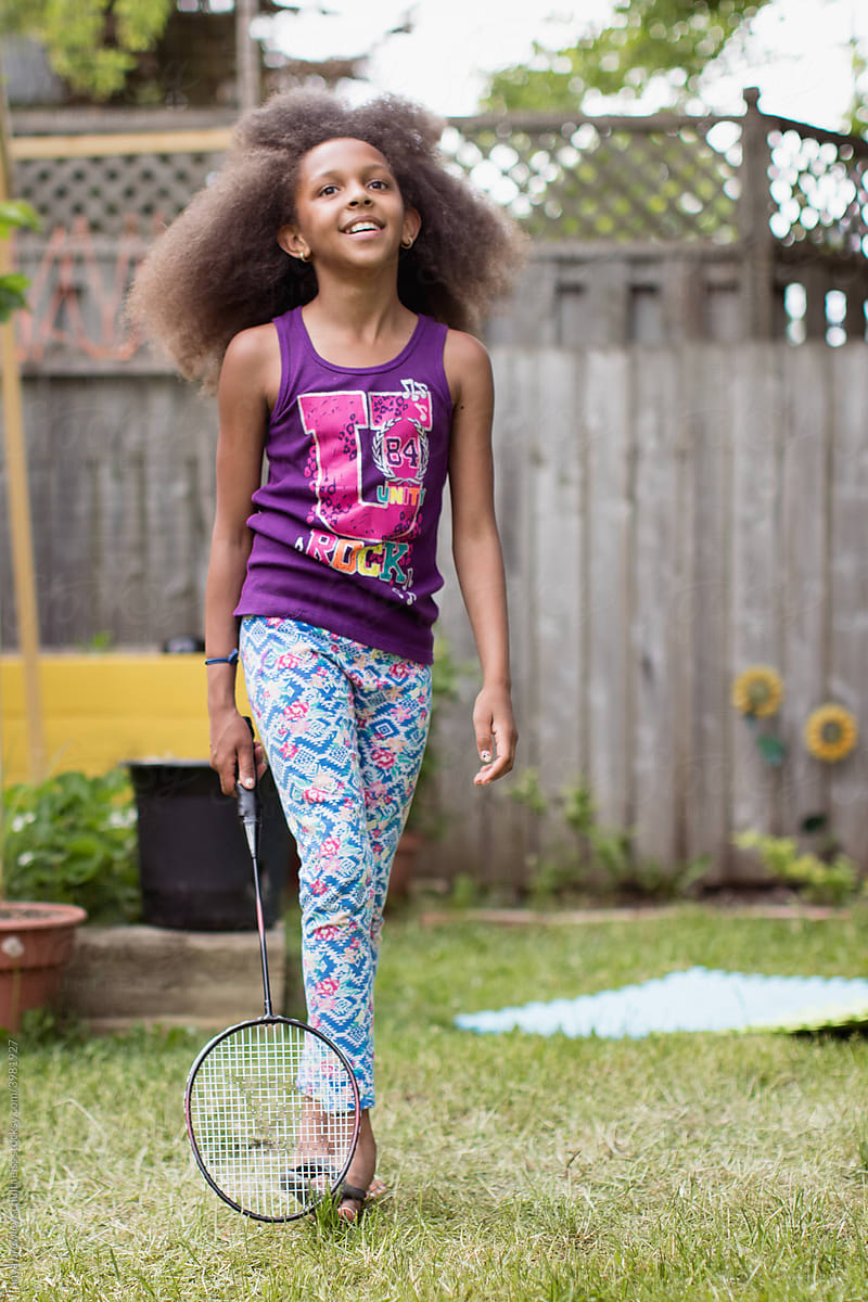 Young girl holding a badminton racket