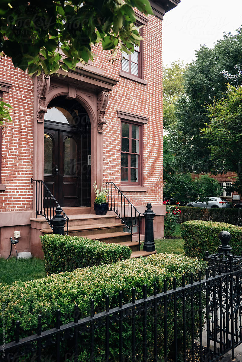 American brownstone house with a nice garden