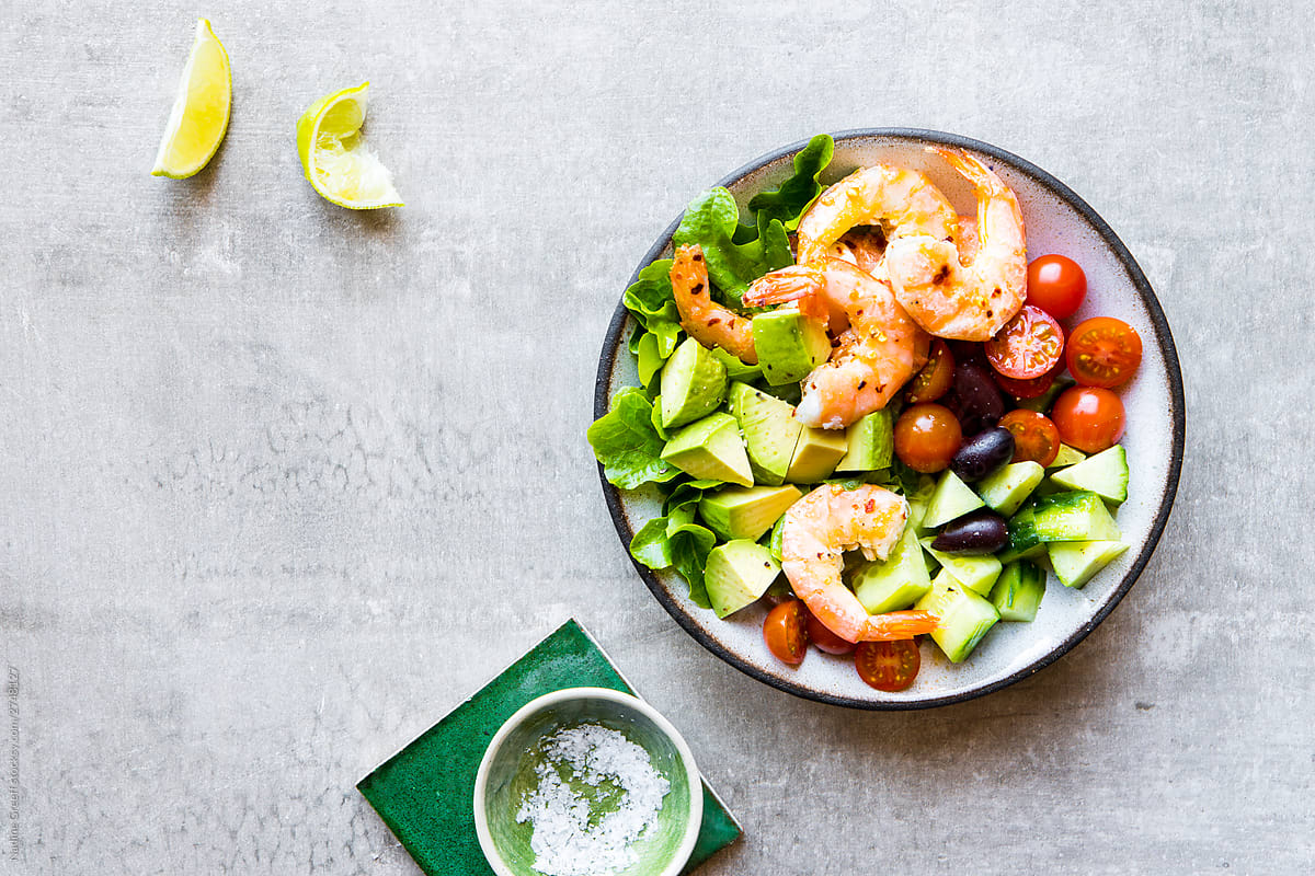Shrimp bowl with crisp lettuce, tomato, cucumber and avocado