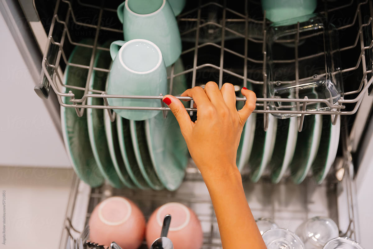 Woman Loading the Dishwasher