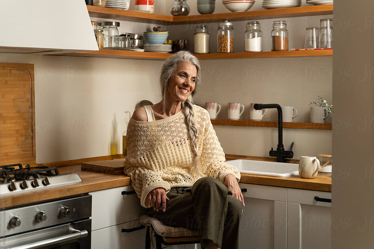 Happy retired woman at home portrait