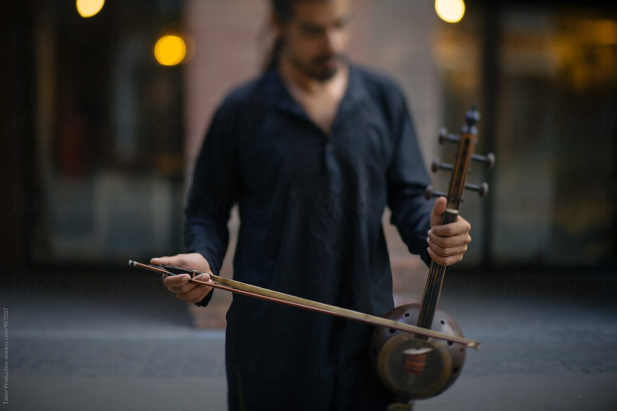 Musician holding kamancha