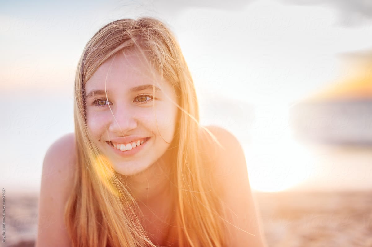Smiling teenage girl at sunset