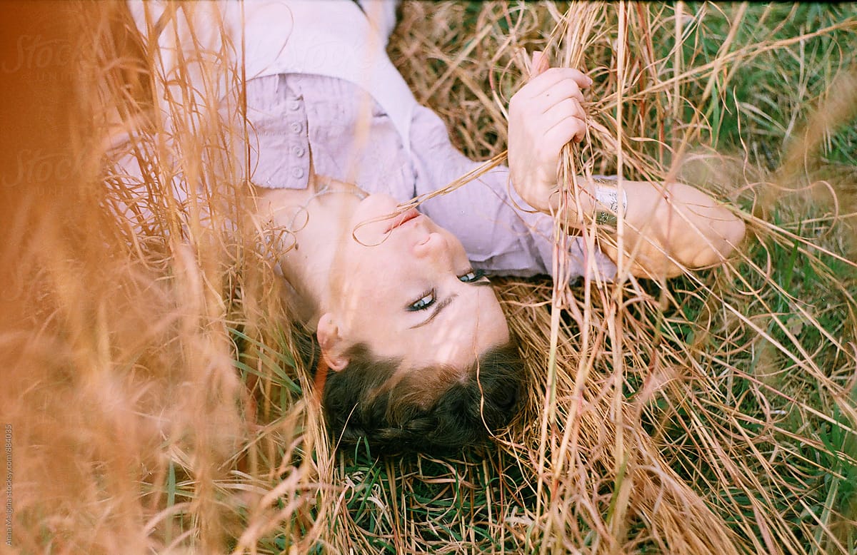 A Beautiful Woman Lying At The Grass By Stocksy Contributor Anna