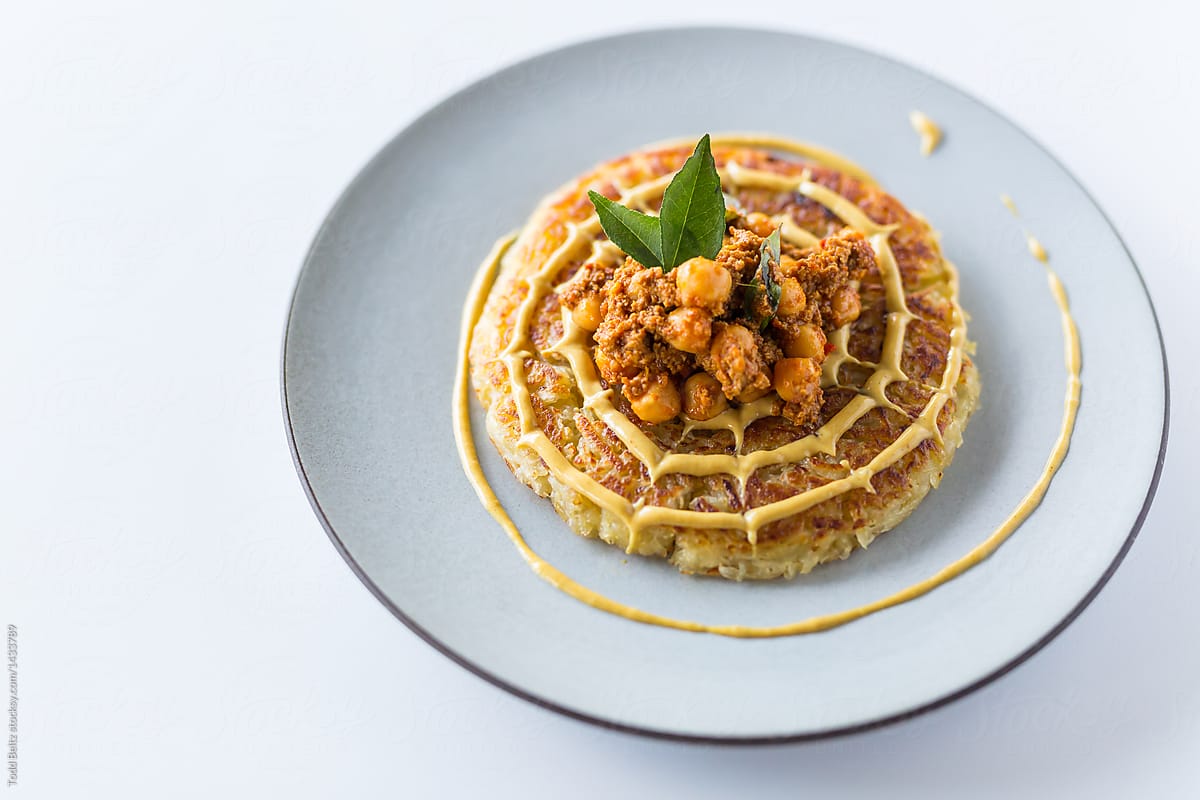 Rosti with chickpeas on a white background.