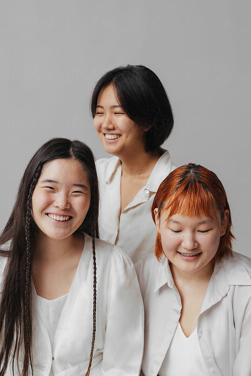 young asian women laughing