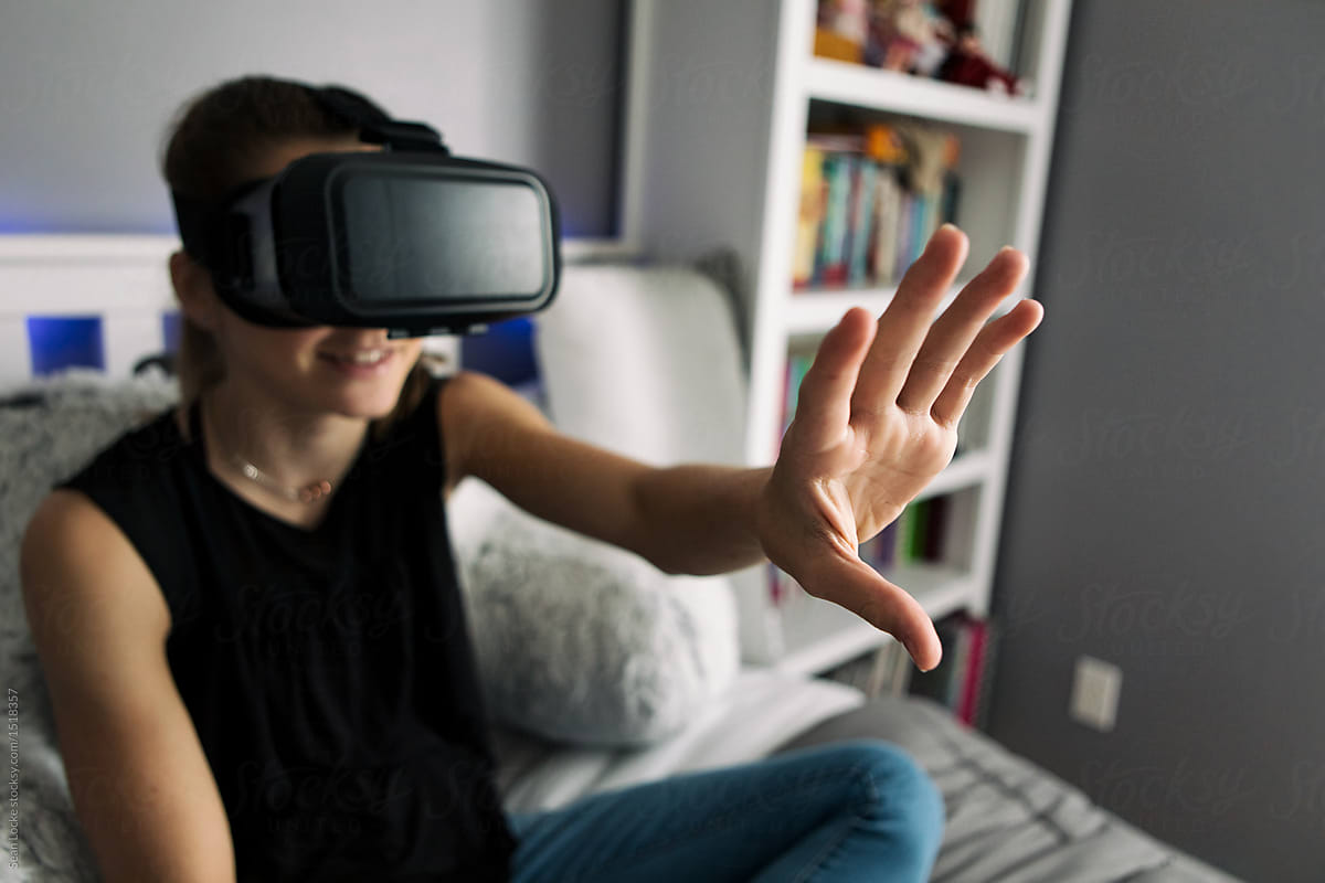 Teenager: Girl Reaches To Touch Virtual Reality