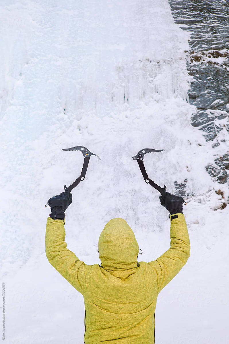 Man with ice axe for ice climbing
