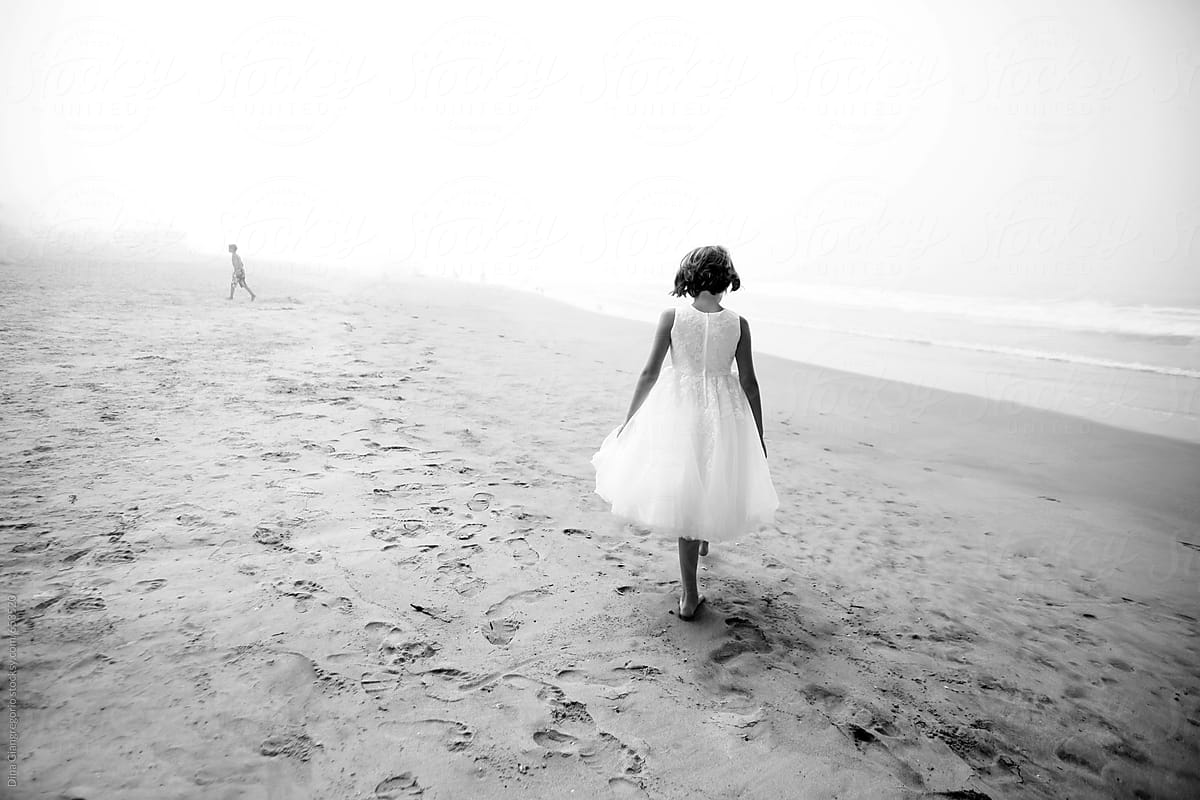 Girl In White Dress Walking On The Beach By Stocksy Contributor Dina