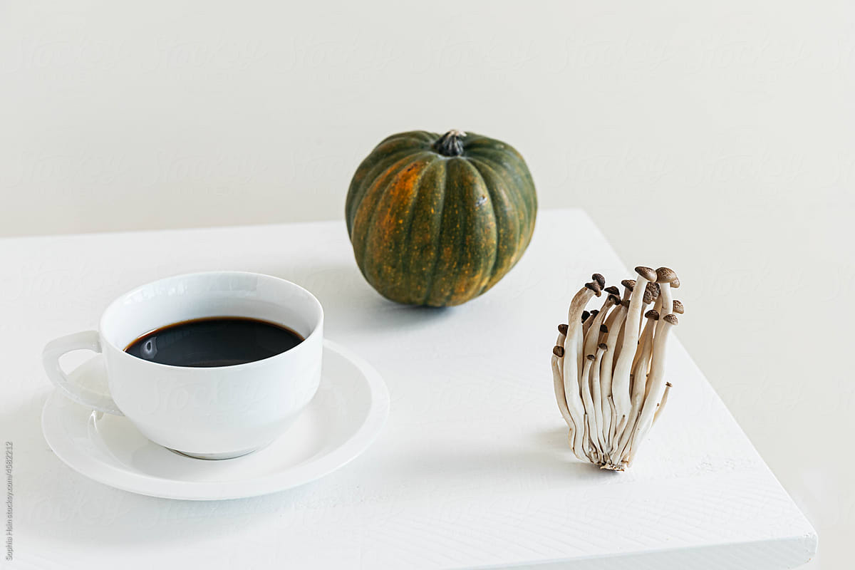 Still life of coffee, squash and mushrooms