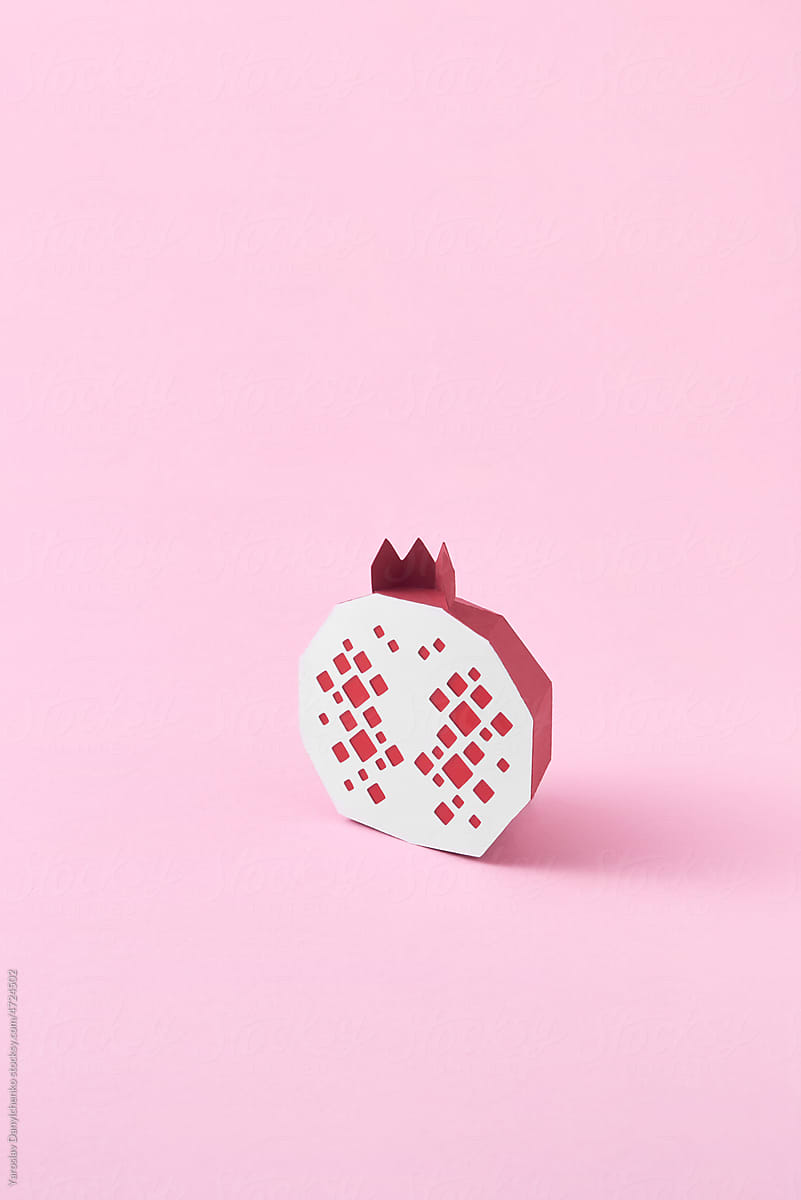 Paper handcraft pomegranate on pink