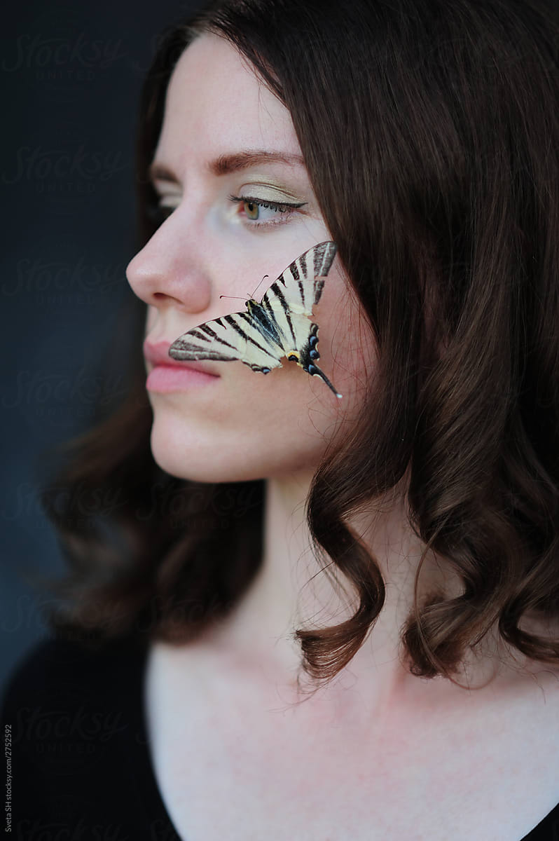 Butterfly on the girl\'s face