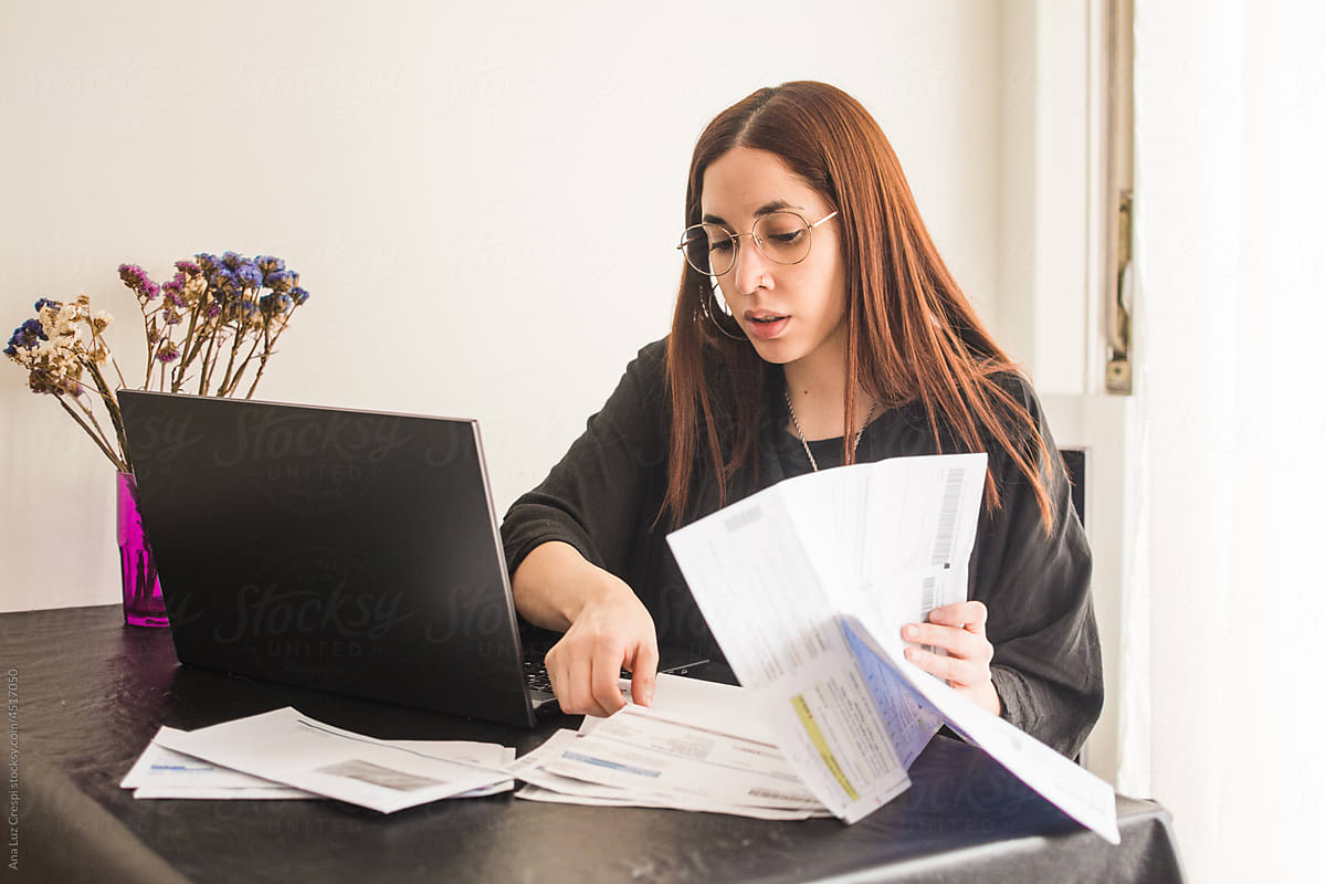 Woman doing paperwork at home