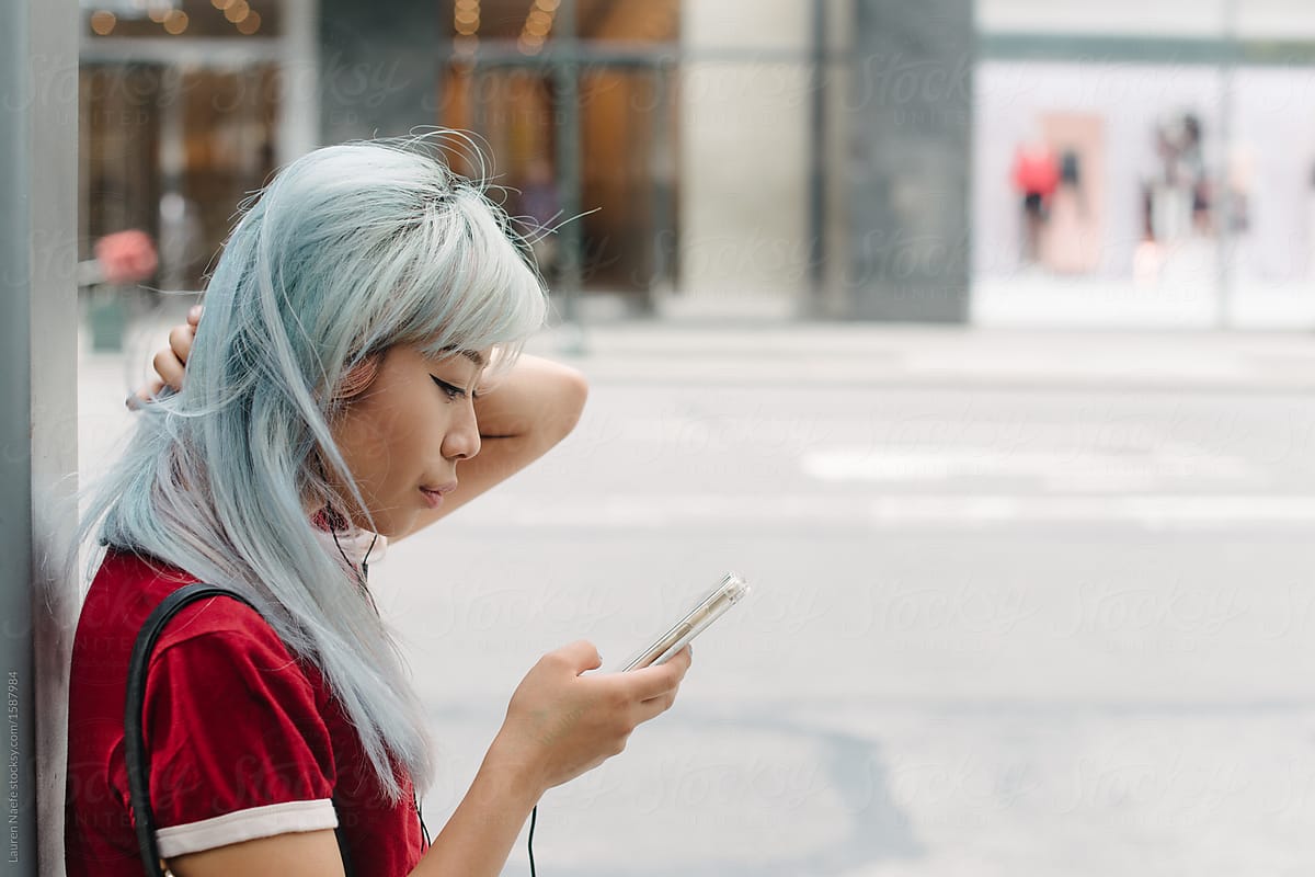 Young woman on phone in the city
