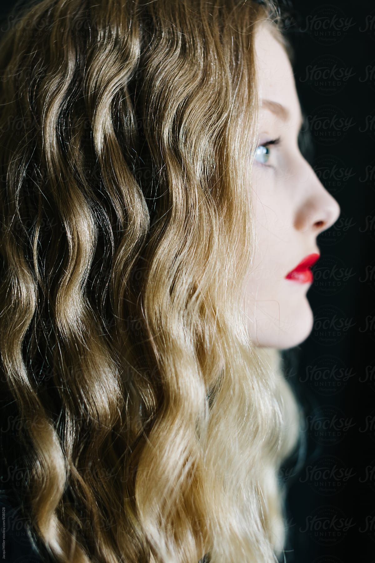 Side profile of Teen Girl with Long Blonde Hair and Red Lipstick - focus on hair
