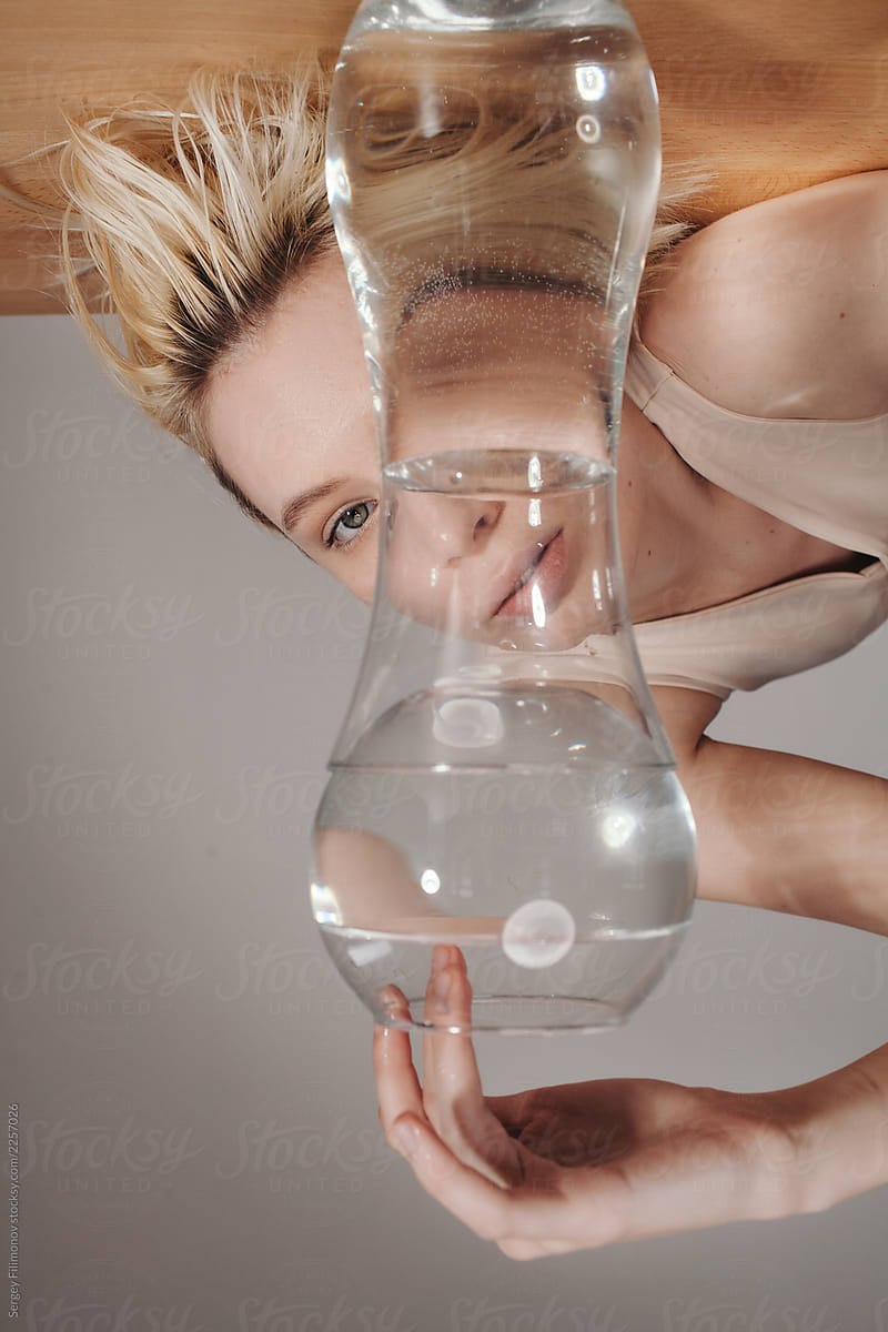 Woman behind glassware with water