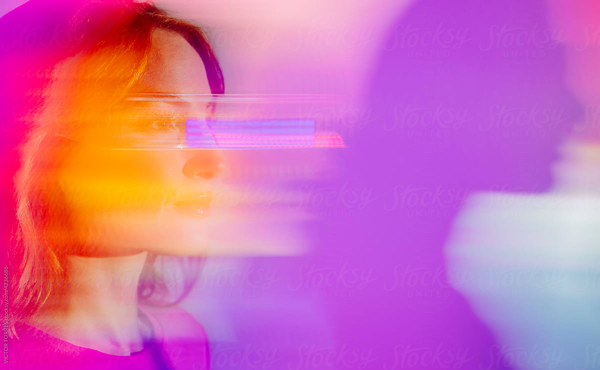 Young woman with led glasses eyes in studio