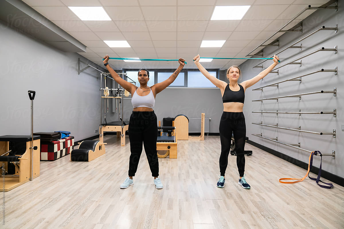 Two Woman Exercise Using Resistance Bands